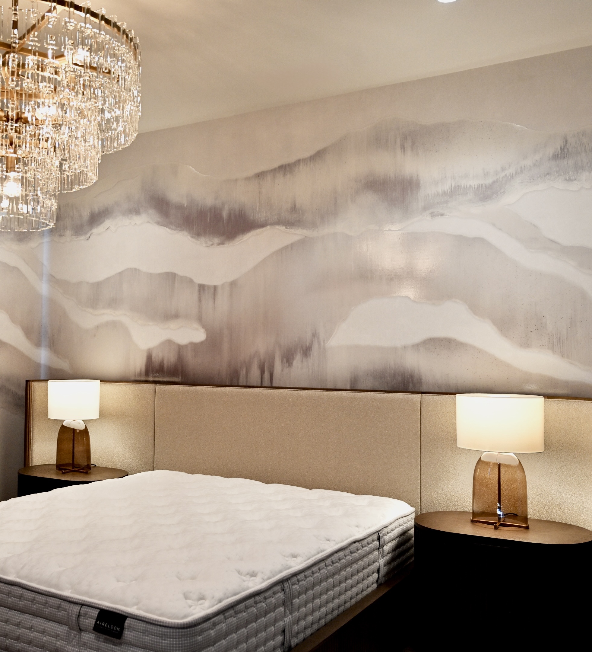 Professional wallpaper installer from Parfait Wallpaper Service applying decorative wallpaper to residential wall