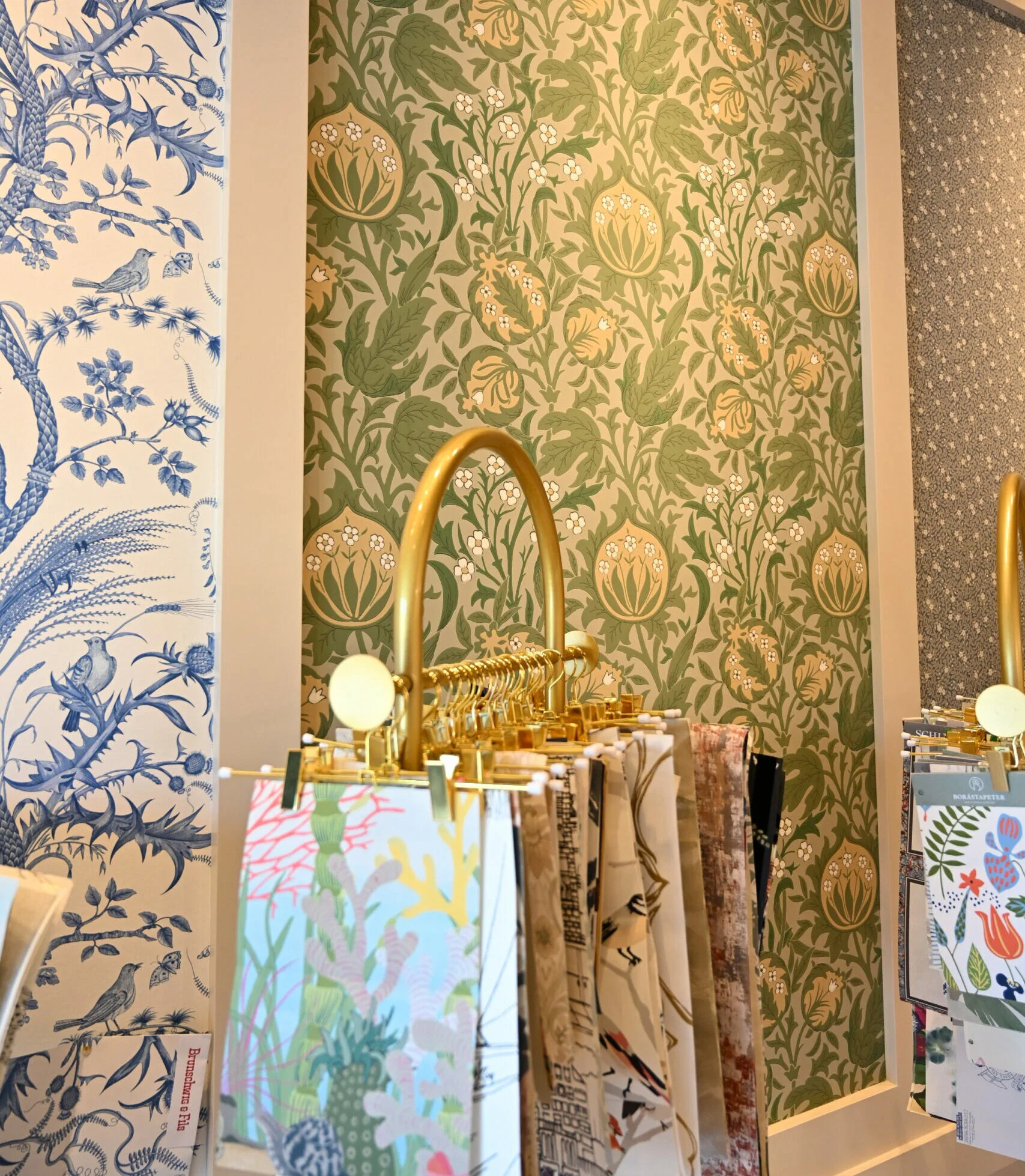 Professional wallpaper installer from Parfait Wallpaper Service applying decorative wallpaper to residential wall